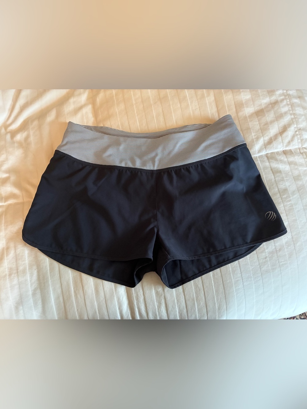MPG charcoal running shorts with pink detail and back zipper pocket, size XS